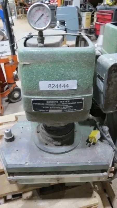 Boxboard Bending Tester Boxboard Bending Tester - The BRDA bending tester scores and folds paperboard, using different combinations of rule and die widths and die penetration depths. Folds the board along the score line. The unit is self-contained hydraulic, using 110VAC electrical supply.