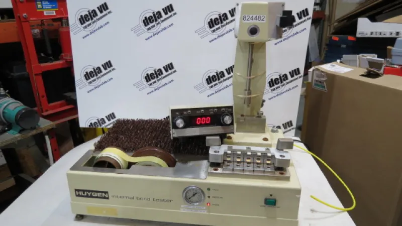 Internal Bond tester - The Huygen Internal Bond Tester measures rapid "Z" direction ruptures of paper and paperboard. It uses the sample bonded by tape to measure an aluminum angle method. Results are digitally displayed. This instrument includes the AV-3 microcomputer display module and the high/low software. Two sets of test yokes and clips are included, to allow testing in both high and low range mode. 