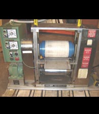 Pilot Soft and Hard Nip Calender - Three roll pilot calender with two heated hard rolls, one soft roll, completely modular, hydraulically loaded to maximum 2000 PLI. Requires 208 volt, 3 phase power. Variable speed drive.